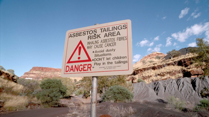 Sign warning of asbestos tailings at Wittenoom Gorge onsite.