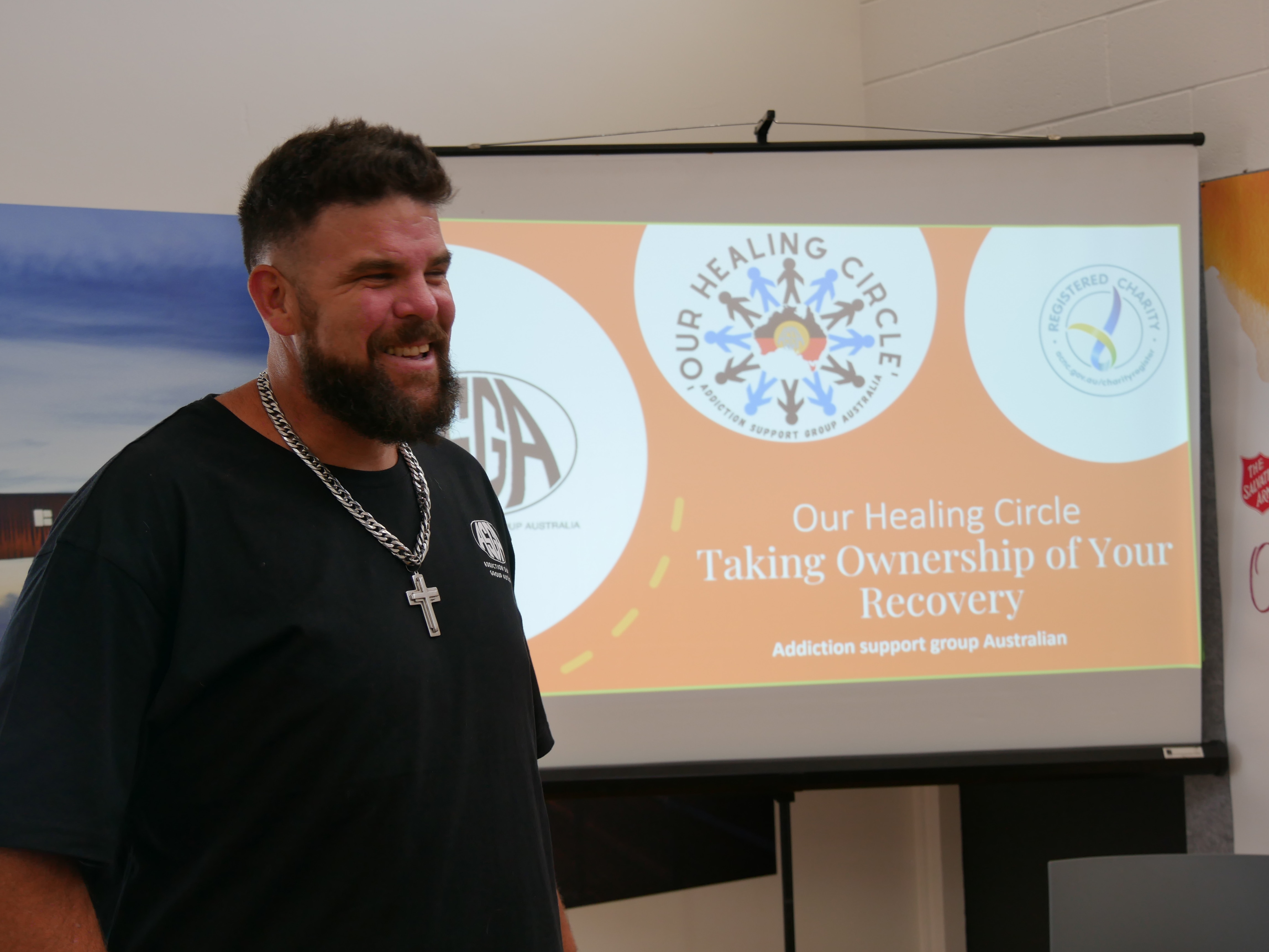 A man stands in front of a room