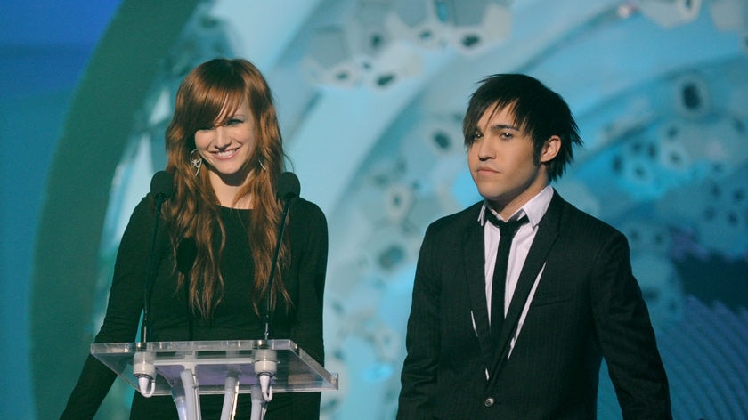 Host Pete Wentz on stage with wife Ashlee Simpson.