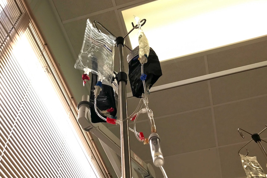 A drip suspended from a trolley at a hospital