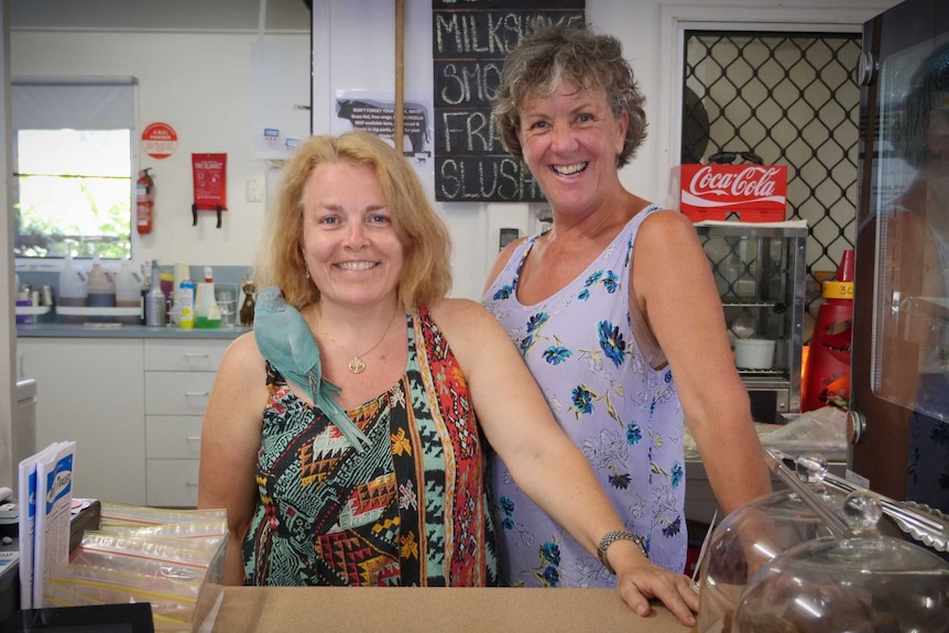 Eungella General Store owner Michaela Pritchard (left) and colleague standing behind the counter.