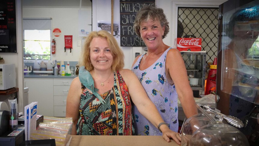 Eungella General Store owner Michaela Pritchard (left) and colleague standing behind the counter.