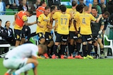 Central Coast Mariners players celebrate a John Hutchinson goal against Melbourne City.