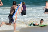 Beachgoers escape the heat at Main Beach on the Gold Coast.