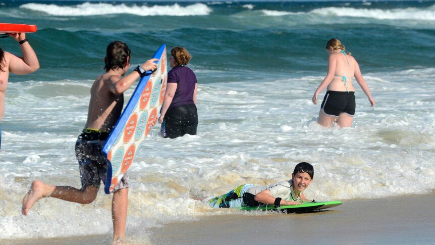 Beachgoers escape the heat at Main Beach on the Gold Coast.