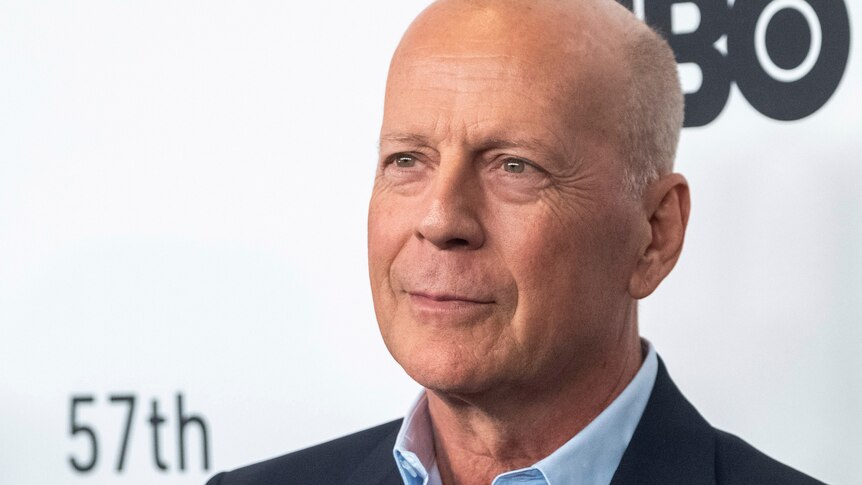 Bruce Willis attends a movie premiere with a shaved head.