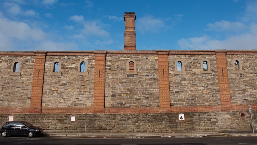 The remaining walls of Retort House 4 border Chief Street, Brompton.