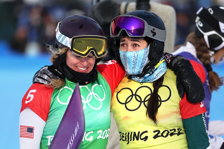 Australian  Belle Brockhoff hugs Gold medallist Lindsey Jacobellis after the Women's Snowboard Cross Big Final