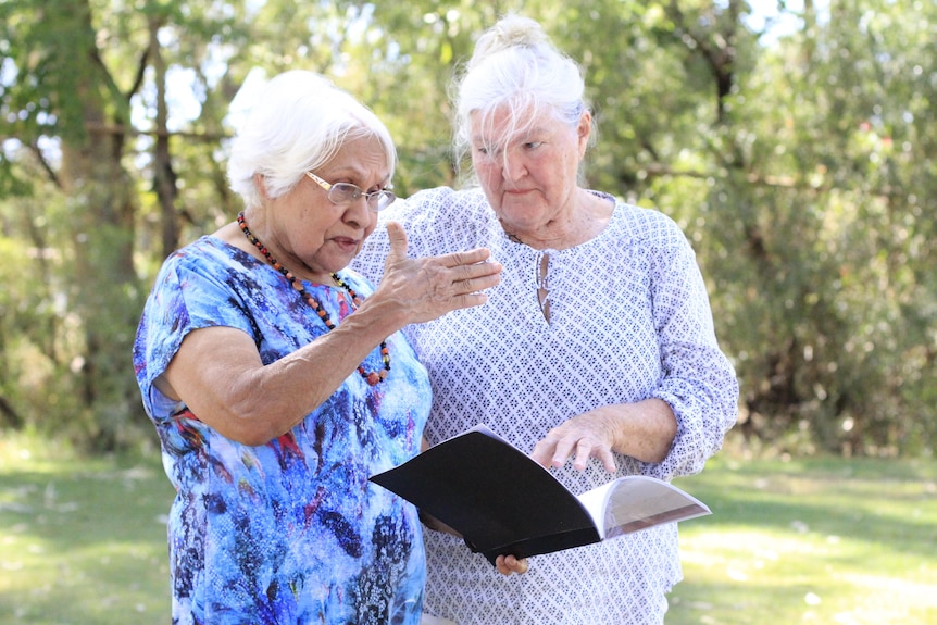 Dawn and Helen read the native title determination together