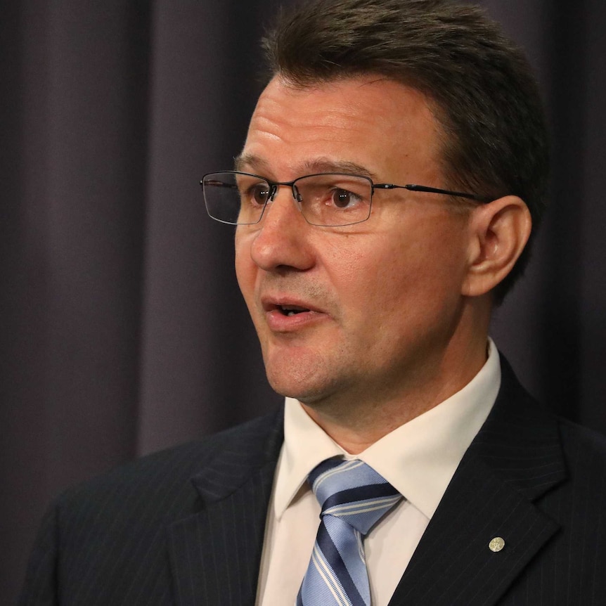 Reece Kershaw speaking at a press conference at Parliament House