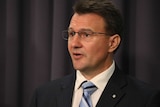 Reece Kershaw speaking at a press conference at Parliament House