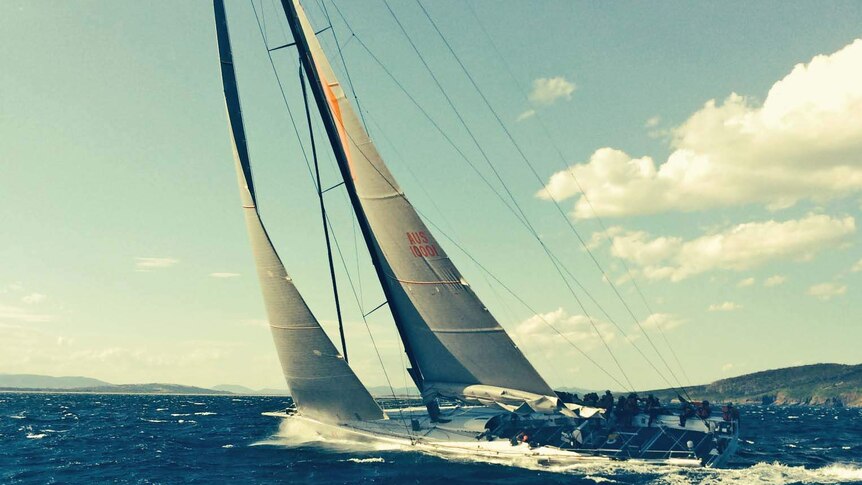 Wild Oats XI sails up the River Derwent in the 2013 Sydney-Hobart yacht race.