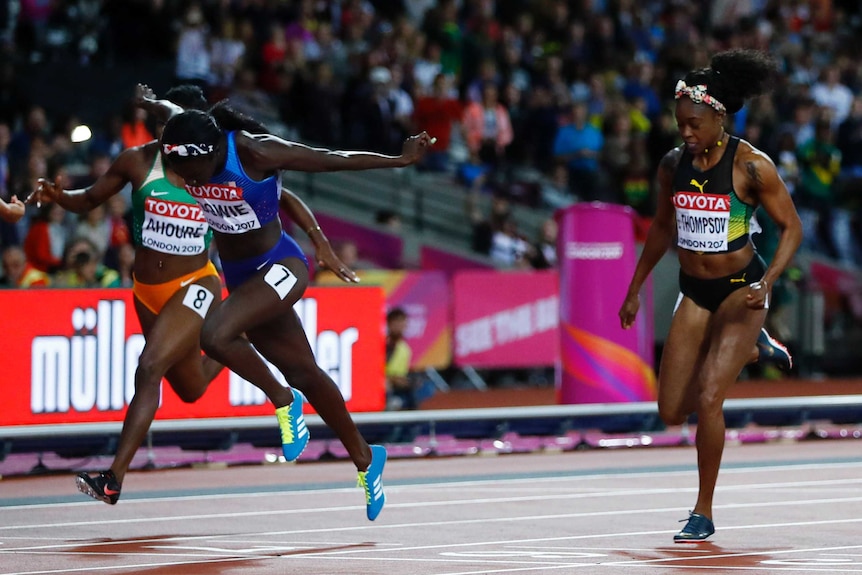 Tori Bowie leans across the finish at the world championships in London.