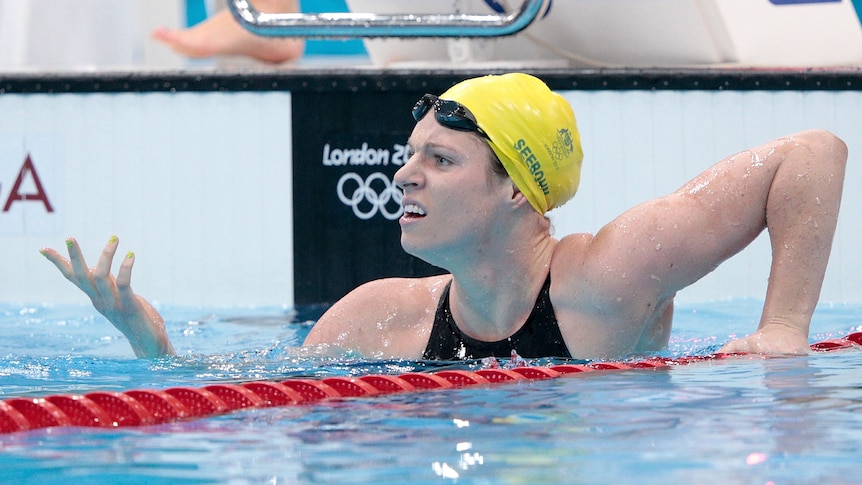 Hot form ... Emily Seebohm looks to the crowd after breaking the Olympic record