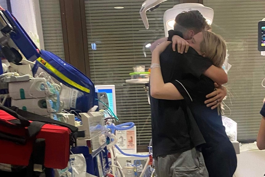 Meg and James hugging at the hospital