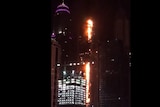 Flames are seen engulfing a huge residential tower in Dubai.