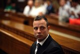 Oscar Pistorius sits in the dock at his trial