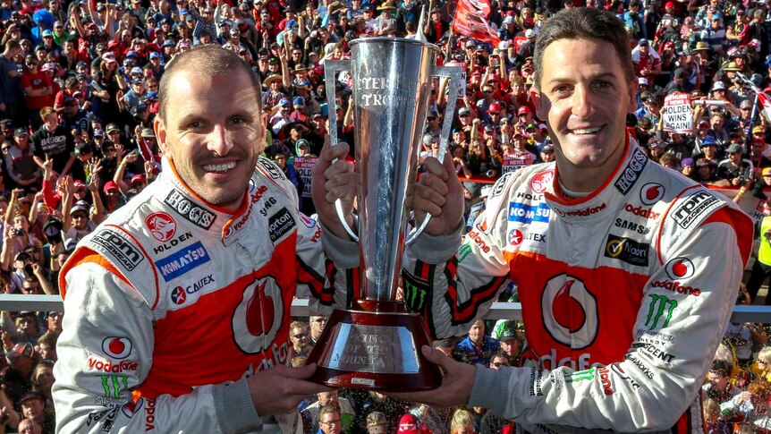 LtoR Paul Dumbrell and Jamie Whincup win the Bathurst 1000.