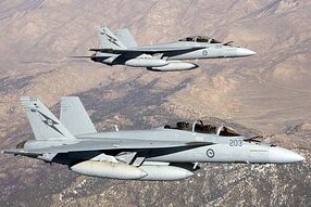 Two Australian Super Hornets perform a work up flight over the Sierra Nevada Mountain Ranges in California. (Department of De...