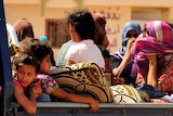 Civilians fleeing Sirte arrive in a truck at Khamseen Gate, 50 km east of Sirte, September 25, 2011.