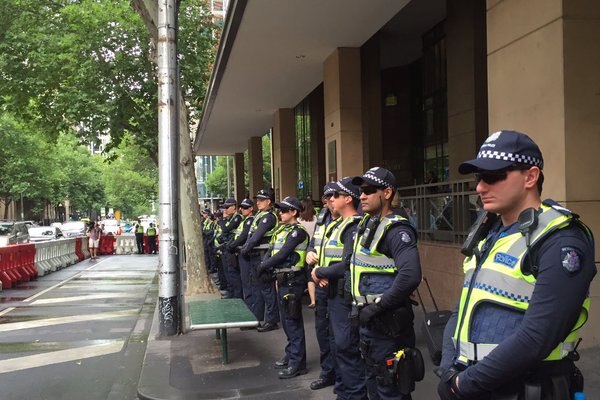 Police stand outside the Melbourne Magistrates Court