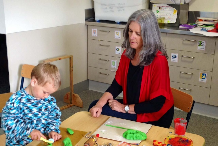 Fran Owens manager of Burnie Child and Family Centre with a toddler.