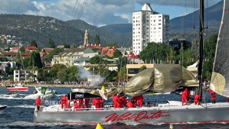 Super maxi Wild Oats crosses the finish line in the 2005 Sydney to Hobart yacht race.