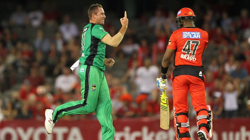 On top ... John Hastings celebrates after taking the wicket of the Renegades' Dwayne Bravo