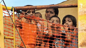 Sri Lankan asylum seekers look out from the Oceanic Viking (File image: AFP)
