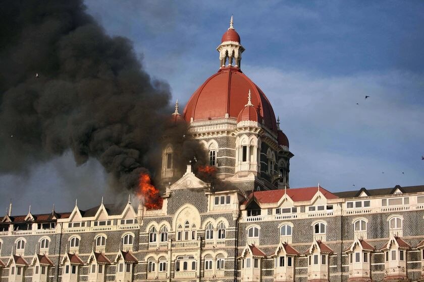 Smoke rises from the Taj Mahal Hotel in Mumbai on November 27, 2008.