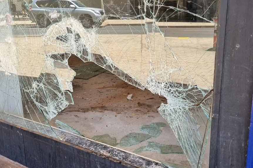 A smashed store window 