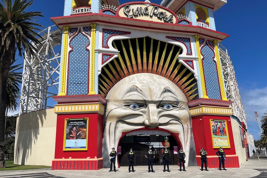 Police stand outside Luna Park.