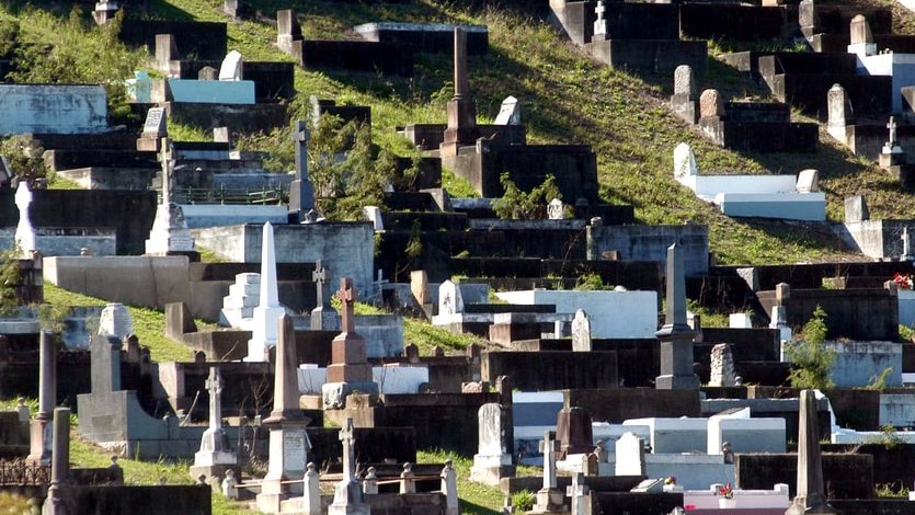 Graves sit on a hillside at Toowong cemetery