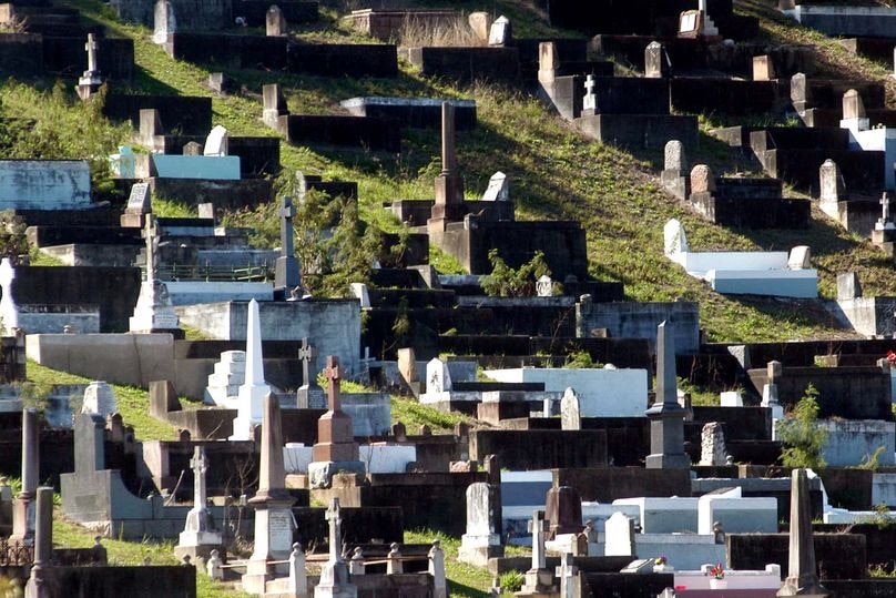 Graves sit on a hillside at Toowong cemetery