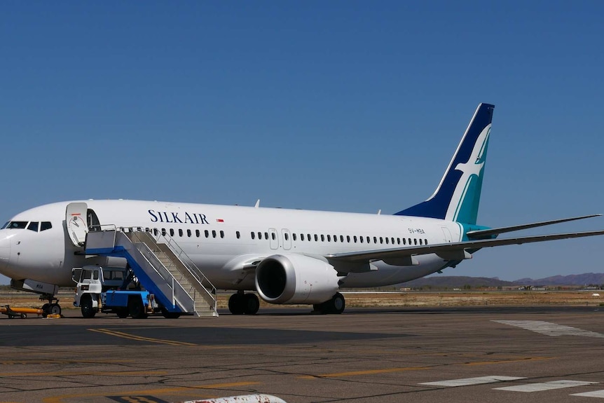 A Silk Air Boeing 737 Max 8 plane on the tarmac at Alice Springs Airport.