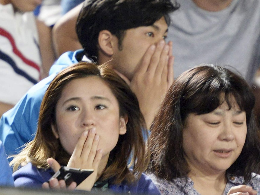 People react to earthquake in Japan