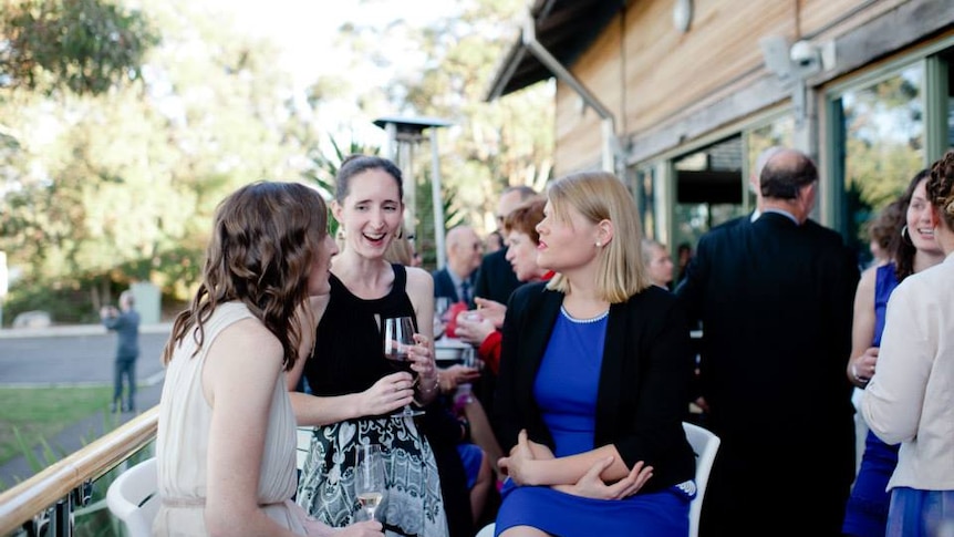 Dr Natasha Moore laughs at a friend's wedding.