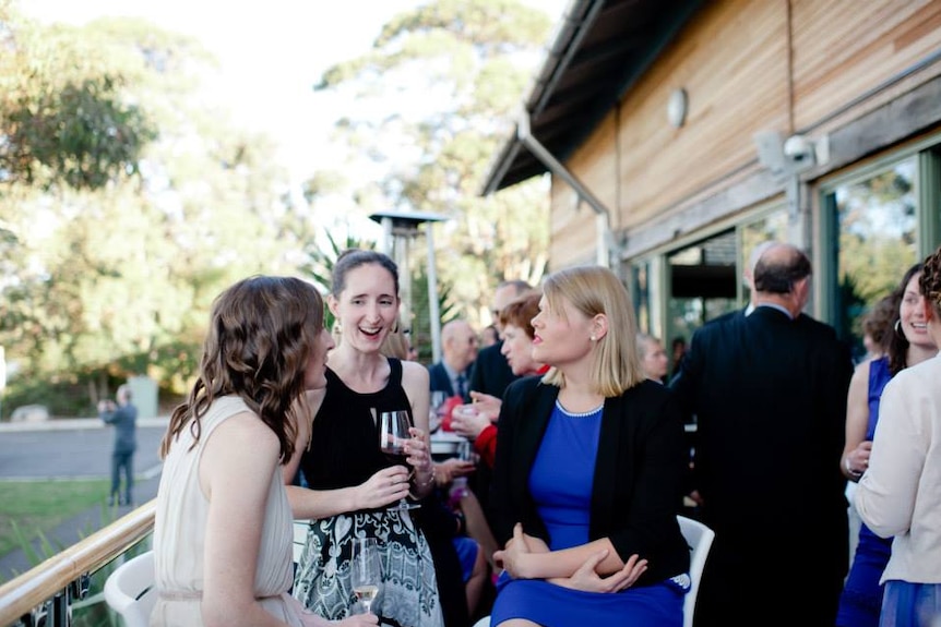 Dr Natasha Moore laughs at a friend's wedding.