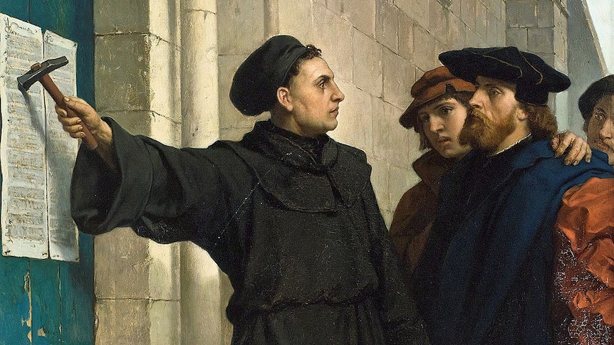 Painting of Martin Luther nailing his Ninety-five Theses to a church door.