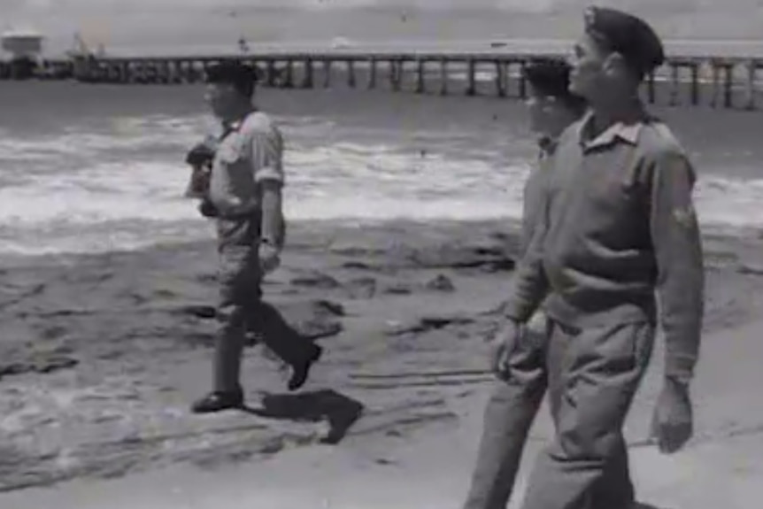 Soldiers canvas the coast around Cheviot Beach in Victoria.