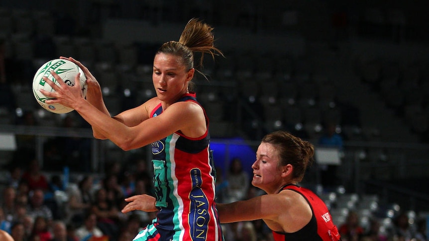 Sharelle McMahon of the Vixens catches the ball  against the Tactix.