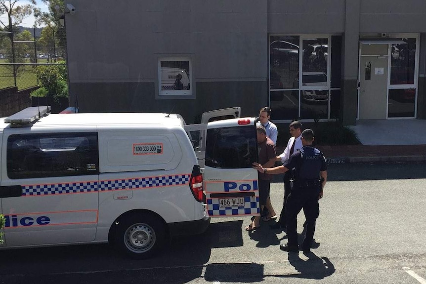 Foster father of murdered schoolgirl Tiahleigh Palmer being taken to the Beenleigh watchhouse