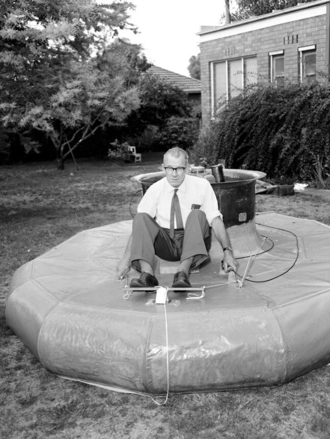 A man showcasing a hovercraft in the 1960s