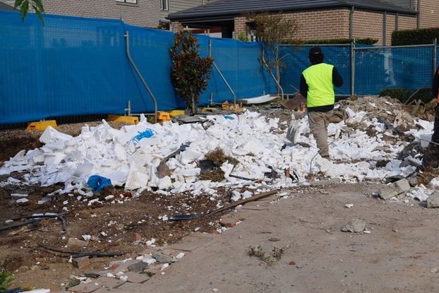 Housing construction site littered with broken waffle pods