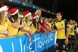 Trent Sainsbury celebrates with fans after Central Coast beat the Melbourne Heart in Gosford.