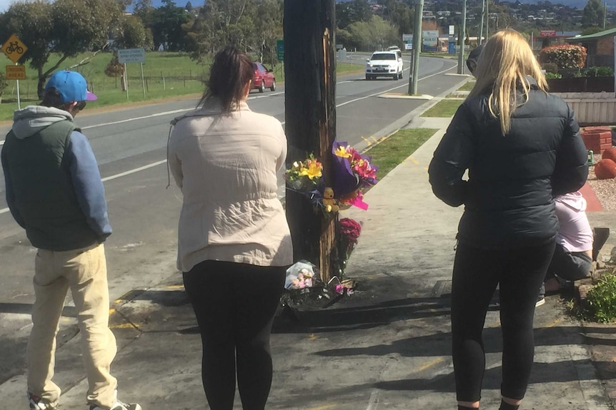 Mourners at the fatal crash site in Sorell, 16 September 2016.