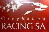 The logo of Greyhound Racing SA on a wall.