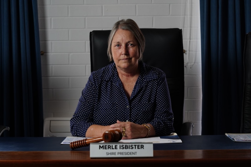 Woman sitting at a desk. 