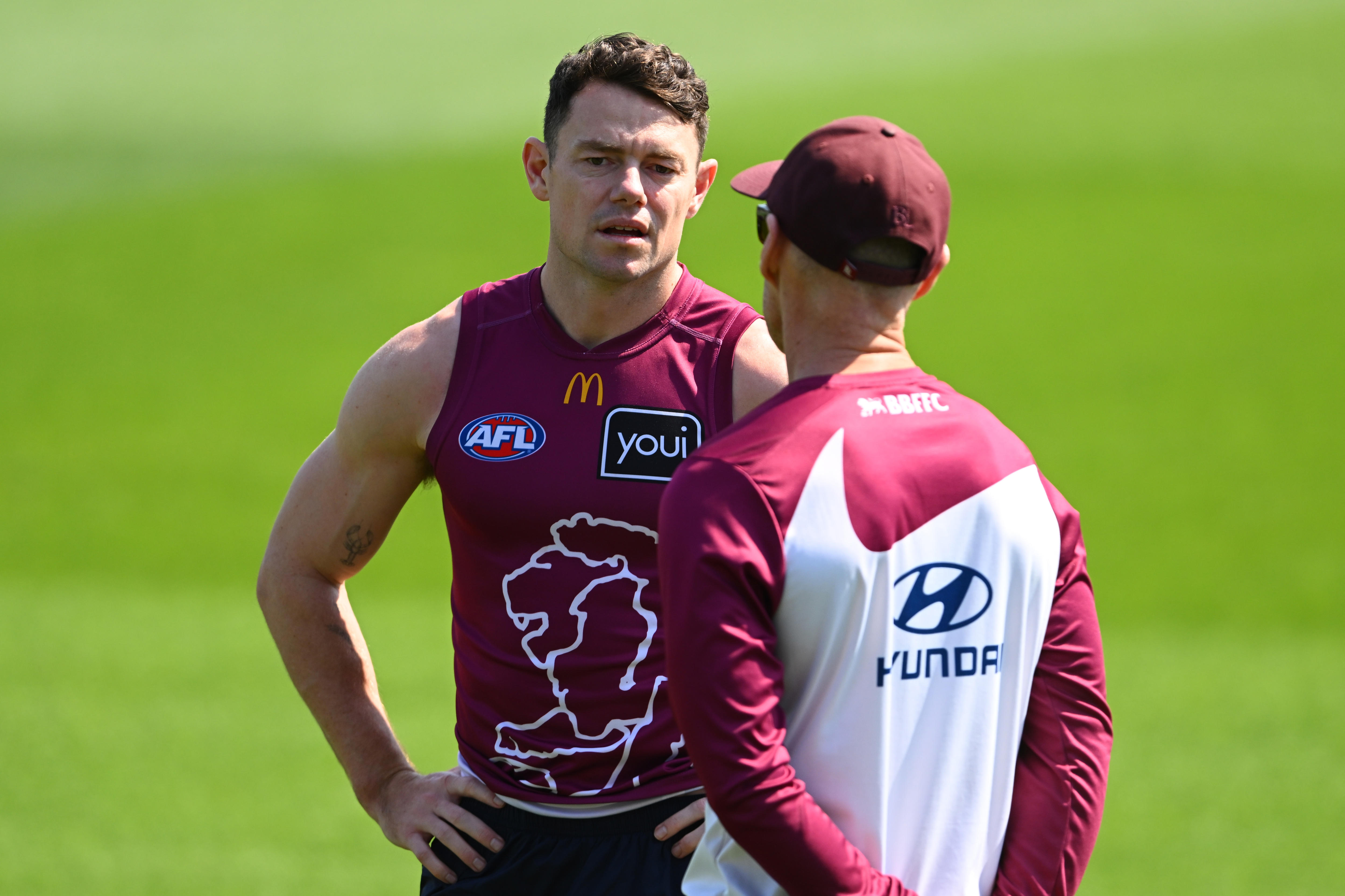 Lachie Neale with a teammate at training