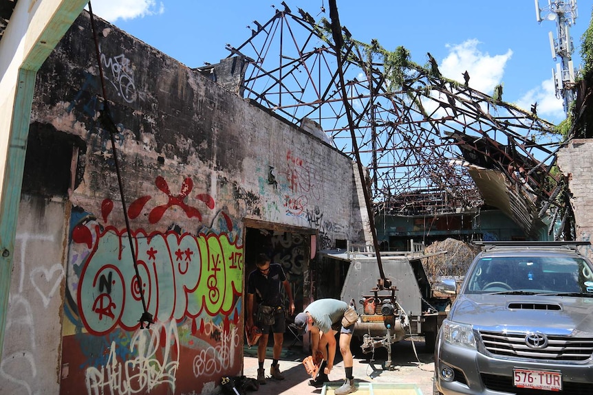 Two builders working  at the site of the restoration of the derelict Red Hill Skate Arena in Brisbane.